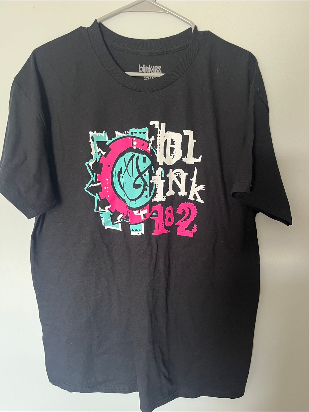 Blink-182 Women's Short Sleeve Graphic Tee — Black with Pink & Teal Logo